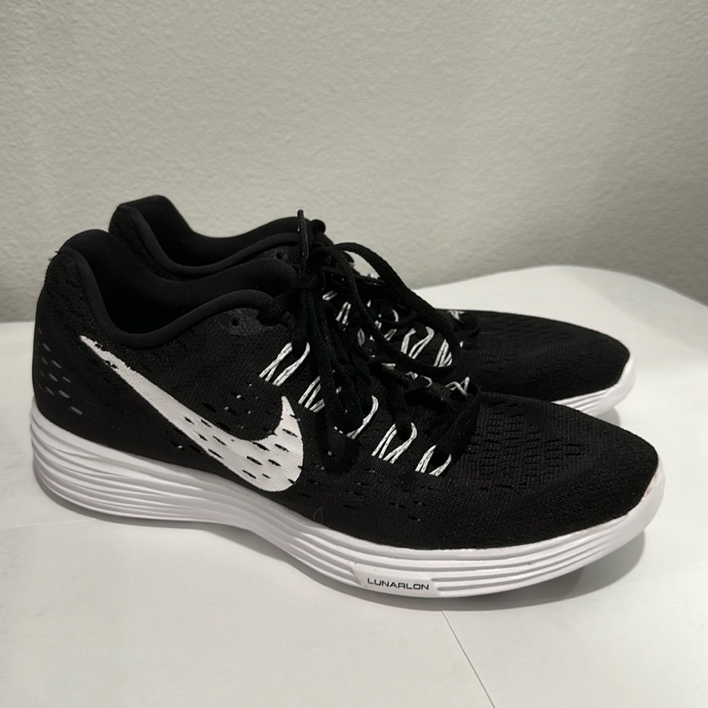 Nike women’s running shoe, black with white lettering, size 9